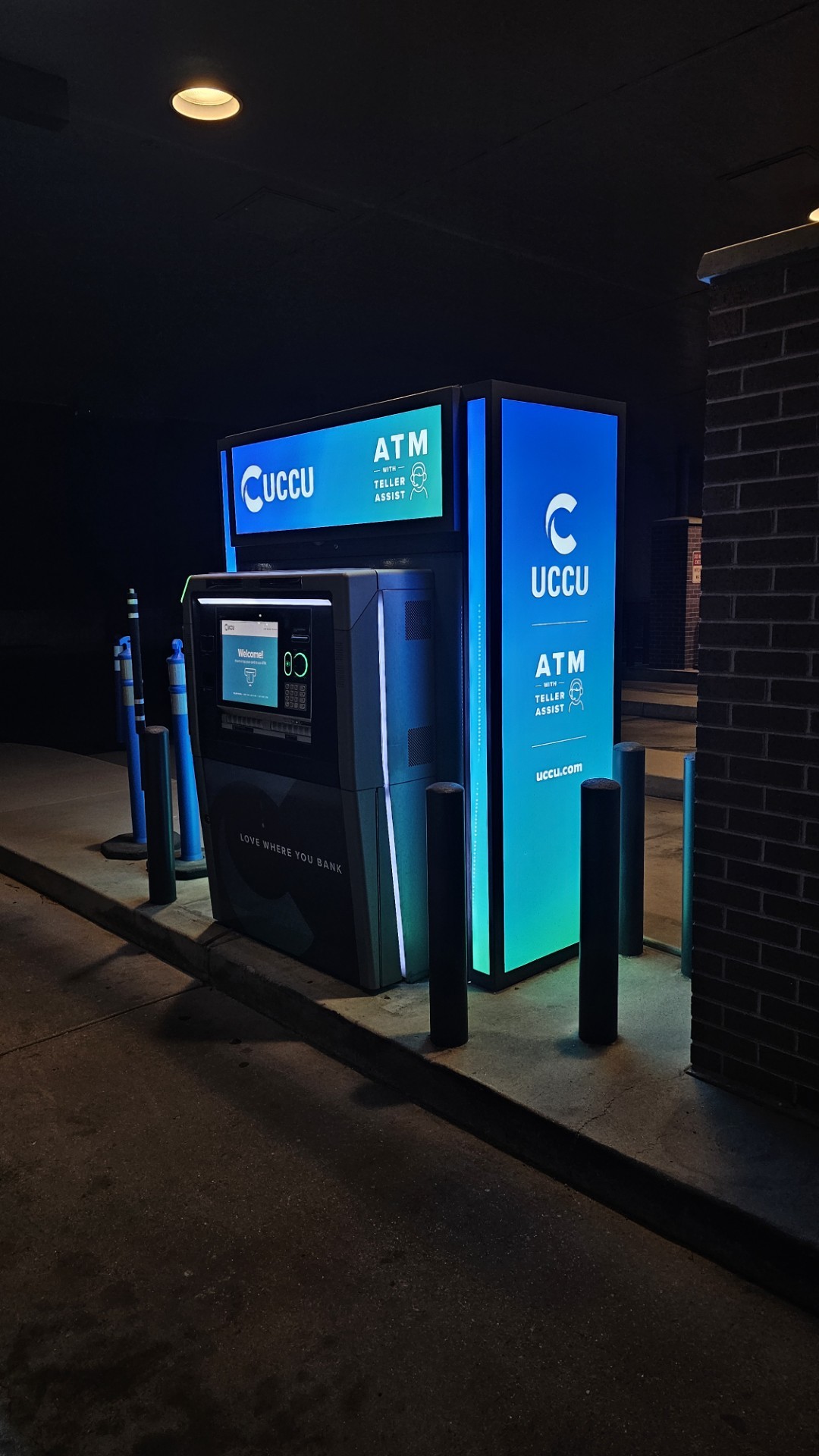 UCCU branded ATM enclosure at night